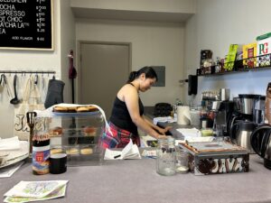 Maluisa Fuentes, a freshman in Hankin’s class, works the noon to 2 p.m. shift at Daytime Java on Friday, Oct. 11. Fuentes enjoys being able to connect with different people through this activity.